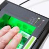 A photo of an i3 livescan device scanning four fingers